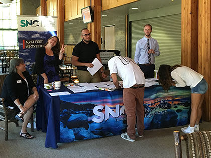 Incoming students checking in to Sierra Nevada University's new student orientation and registration.