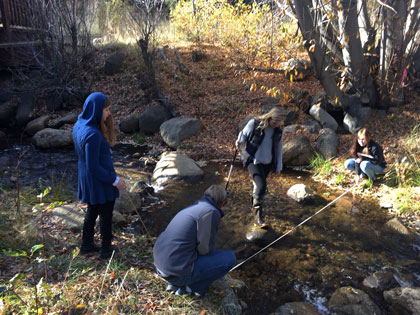 Environmental science students at SNU Tahoe measure steam depth near campus