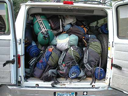 Wilderness Orientation participants load up the SNU Tahoe van with their backpacks filled with gear