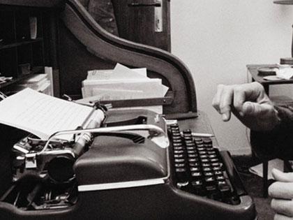 Writer working on old typewriter