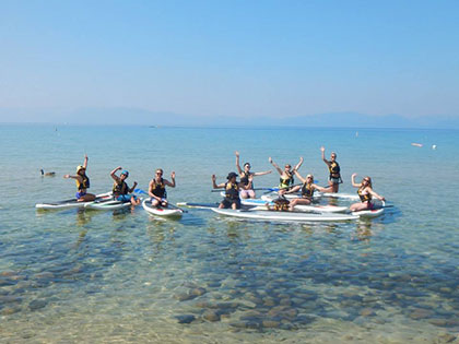SNU Tahoe students go paddle-boarding during the Tahoe Orientation, a way for new students to get to know each other better 
