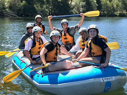 Sierra Nevada University students in their raft at the beginning of a whitewater rafting trip