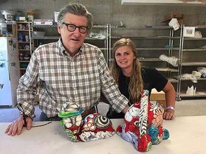 Student Shawnie Personius showing her work to artist and instructor Michael Lucero during a summer art workshop at Sierra Nevada College.