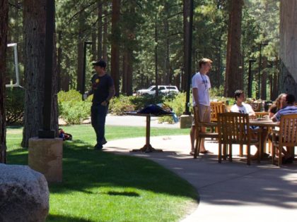 Students relax between classes outside Patterson Dining Hall at Sierra Nevada University