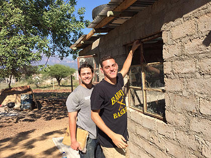 Global Business Management students helping to renovate a rural preschool in Thorny Bush, South Africa on a Service Learning study abroad trip.