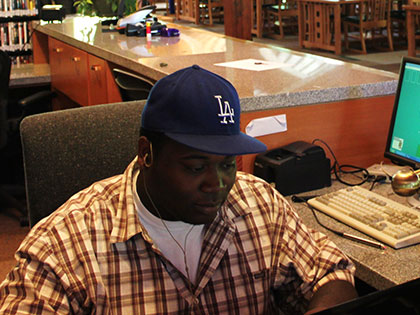 SNC Tahoe student takes some time to apply for scholarships while working in Prim Library