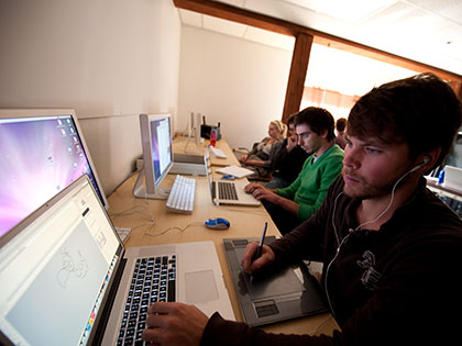 Digital Arts students connect drawing pads to their laptops to see their drawing skills come to life
