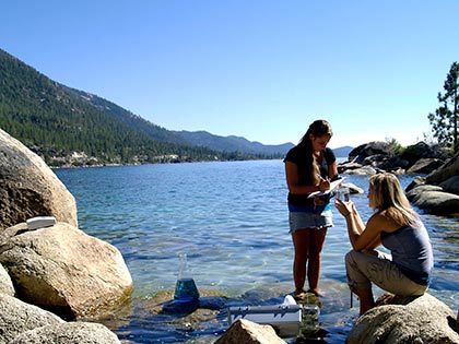 Two Sierra Nevada University science students analyze water samples in Lake Tahoe
