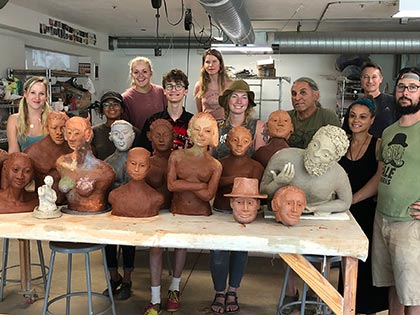 Sierra Nevada University summer art workshops 2018 - artist Arthur Gonzalez with the students and their ceramic busts from his workshop When Clay Becomes Skin, the Inside Out Technique