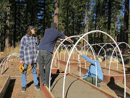 Sustainability students in the beginning stages of building greenhouses at Sierra Nevada University